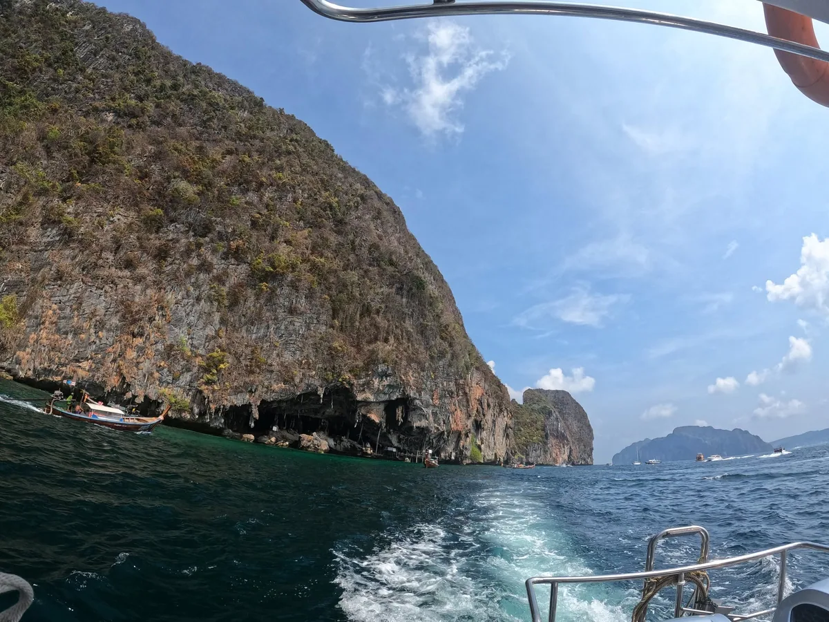Sea and limestone cliffs photographed from a boat during a marine site visit shared by Southern IoT.